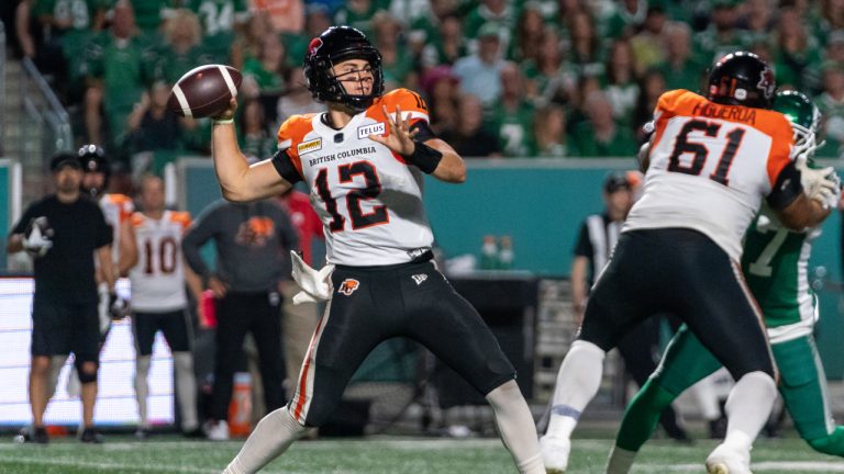 BC Lions quarterback Nathan Rourke (12) looks downfield before throwing against Saskatchewan Roughriders during the second quarter of CFL football action in Regina on Friday, August 19, 2022. (Heywood Yu/CP)