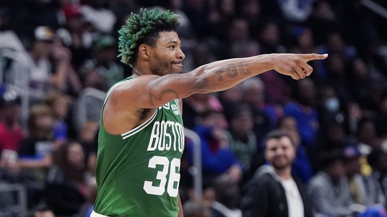 Boston Celtics guard Marcus Smart points to teammates after a basket during a game against the Detroit Pistons, Saturday, Nov. 12, 2022, in Detroit. (Carlos Osorio/AP)