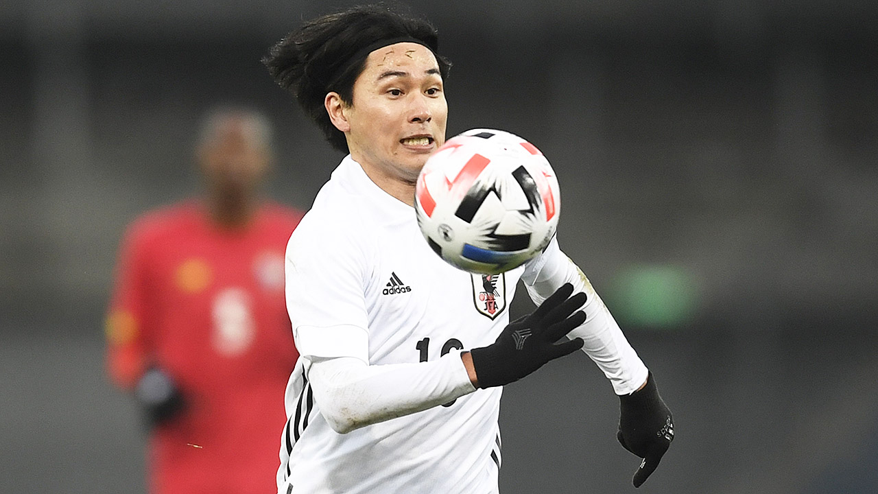 Japan will need Takumi Minamino to bring his scoring touch from qualifying into the World Cup in Qatar. (Andreas Schaad/AP)