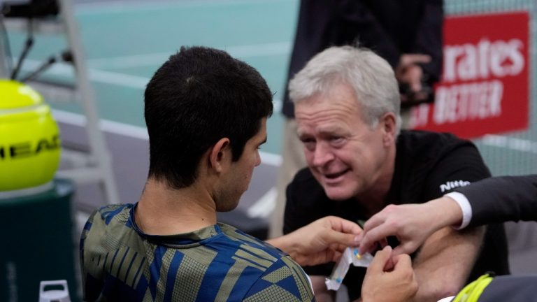 Spain's Carlos Alcaraz is treated during his quarterfinal match of the Paris Masters tennis tournament against Holger Rune from Denmark, at the Accor Arena, Friday, Nov. 4, 2022 in Paris. (AP Photo/Thibault Camus)