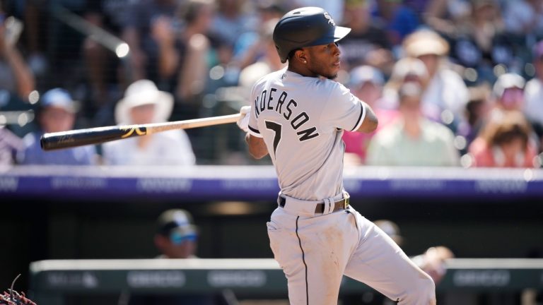 Chicago White Sox's Tim Anderson hits an RBI-single off Colorado Rockies relief pitcher Lucas Gilbreath in the seventh inning of a baseball game Wednesday, July 27, 2022, in Denver. (David Zalubowski/AP)