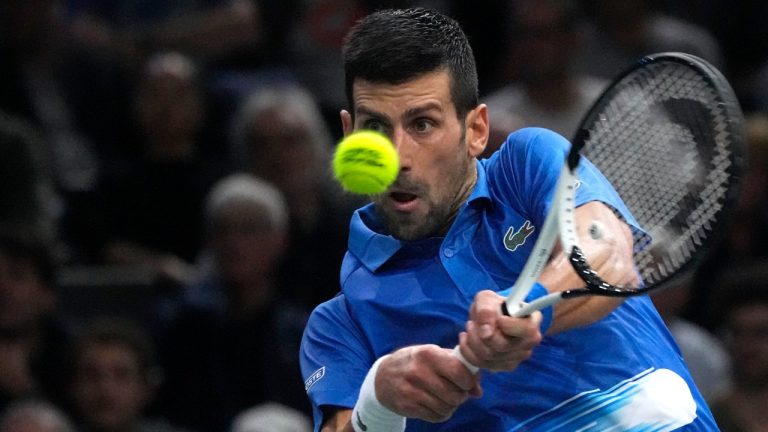 Novak Djokovic of Serbia returns the ball to Stefanos Tsitsipas of Greece during their semi final match of the Paris Masters tennis tournament at the Accor Arena in Paris, Saturday, Nov. 5, 2022. (Michel Euler/AP)