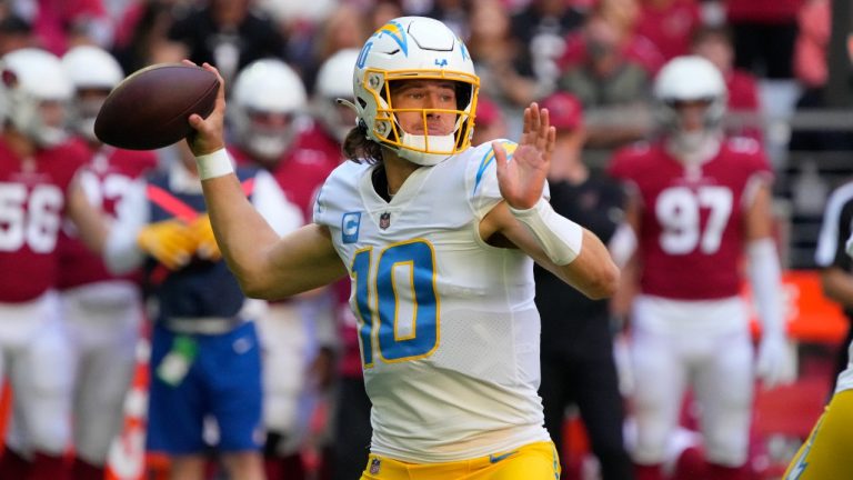Los Angeles Chargers quarterback Justin Herbert (10) looks to pass against the Arizona Cardinals during the first half of an NFL football game, Sunday, Nov. 27, 2022, in Glendale, Ariz. (Rick Scuteri/AP)