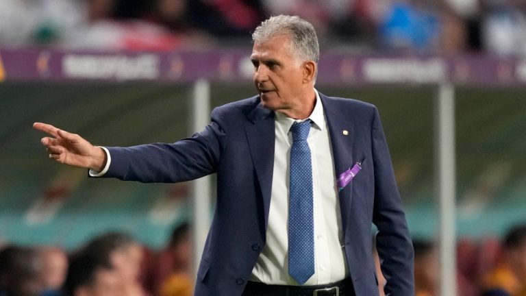 Iran's head coach Carlos Queiroz gives instructions to his players during the World Cup group B soccer match between England and Iran at the Khalifa International Stadium in Doha, Qatar, Monday, Nov. 21, 2022. (Frank Augstein/AP) 