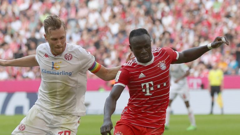 Bayern's Sadio Mane, right, defends the ball from Mainz's Silvan Widmer during a match between Bayern Munich and Mainz at the Allianz Arena in Munich, Germany, Saturday, Oct. 29, 2022. (Alexandra Beier/AP)