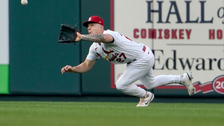 St. Louis Cardinals center fielder Tyler O'Neill dives to catch a fly ball by Washington Nationals' Lane Thomas for an out during the first inning of a baseball game against the Washington Nationals. (Jeff Roberson/AP)