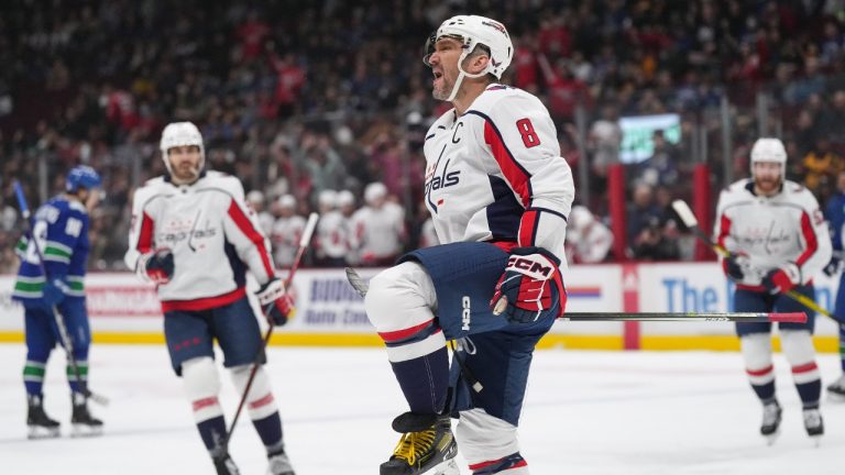 Washington Capitals' Alex Ovechkin, of Russia, celebrates his first goal against the Vancouver Canucks during the first period of an NHL hockey game in Vancouver, on Tuesday, November 29, 2022. (Darryl Dyck/CP)