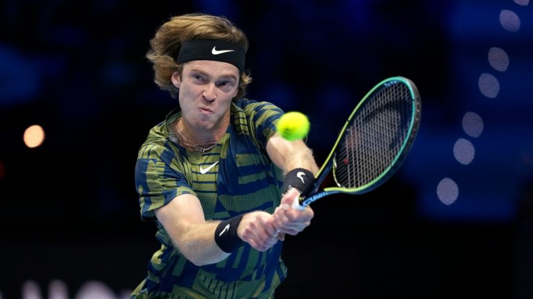 Russia's Andrey Rublev returns the ball to Russia's Daniil Medvedev during their singles tennis match of the ATP World Tour Finals, at the Pala Alpitour in Turin, Italy, Monday, Nov. 14, 2022. (Antonio Calanni/AP)