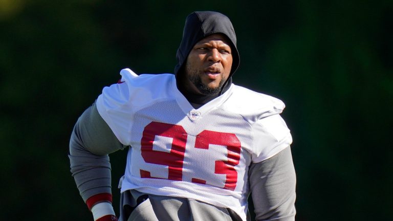 Tampa Bay Buccaneers defensive end Ndamukong Suh (93) stretches during an NFL football practice Wednesday, Jan. 6, 2021, in Tampa, Fla. The Buccaneers play the Washington Football Team in a playoff game Saturday night. (AP Photo/Chris O'Meara)