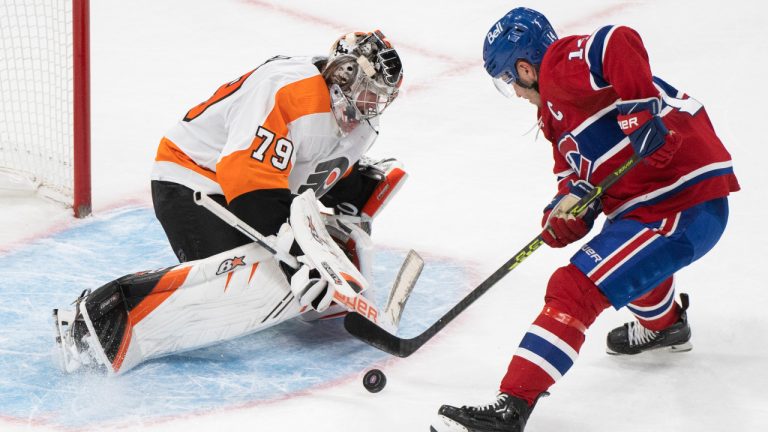 Montreal Canadiens’ Nick Suzuki scores against Philadelphia Flyers goaltender Carter Hart during shootout NHL hockey action in Montreal, Saturday, November 19, 2022. (Graham Hughes/CP) 