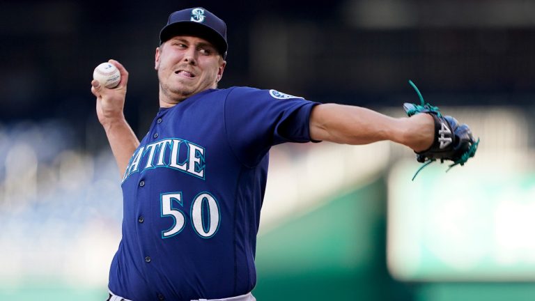 Seattle Mariners starting pitcher Erik Swanson throws to the Washington Nationals in the first inning of the second game of a baseball doubleheader, Wednesday, July 13, 2022, in Washington. (Patrick Semansky/AP) 