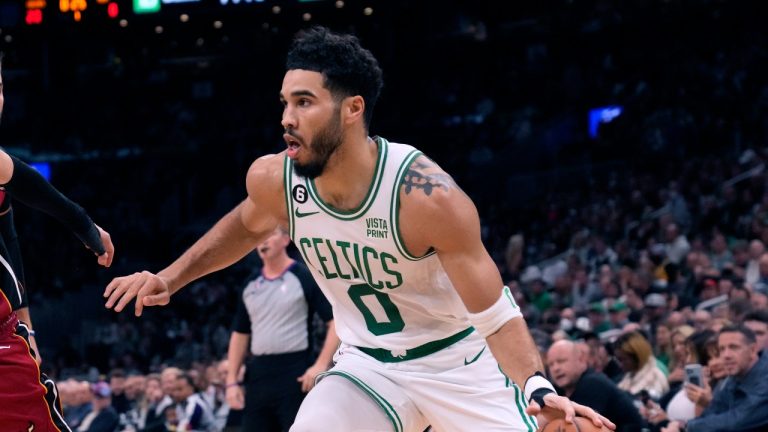 Boston Celtics forward Jayson Tatum (0) drives to the basket against Miami Heat guard Tyler Herro (14) during the first half of an NBA basketball game Wednesday, Nov. 30, 2022, in Boston. (AP Photo/Charles Krupa)