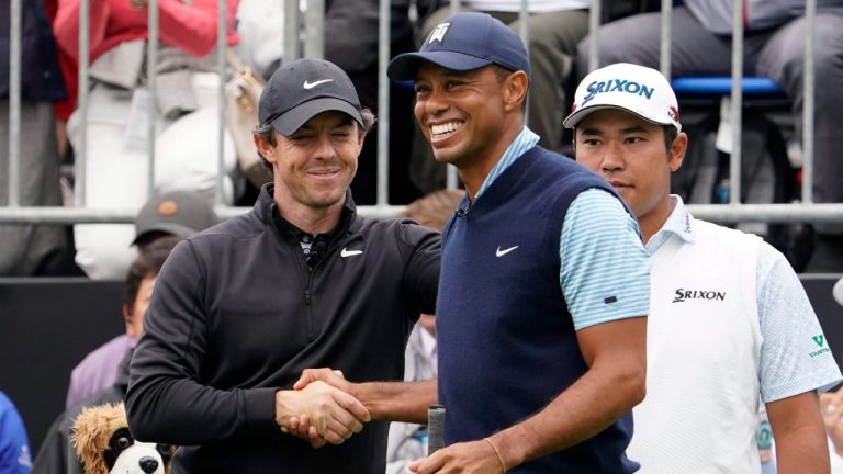 Tiger Woods of the United States, center, shakes hands with Rory McIlroy of Northern Ireland, left, as Hideki Matsuyama of Japan, right, stands during the Challenge: Japan Skins event ahead of the Zozo Championship PGA Tour at Accordia Golf Narashino C.C. in Inzai, east of Tokyo, Monday, Oct. 21, 2019. (Lee Jin-man/AP)