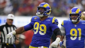 Los Angeles Rams defensive tackle Aaron Donald, left, celebrates after a sack as defensive tackle Greg Gaines watches during the first half of an NFL football game against the San Francisco 49ers Sunday, Oct. 30, 2022, in Inglewood, Calif. (Gregory Bull/AP)