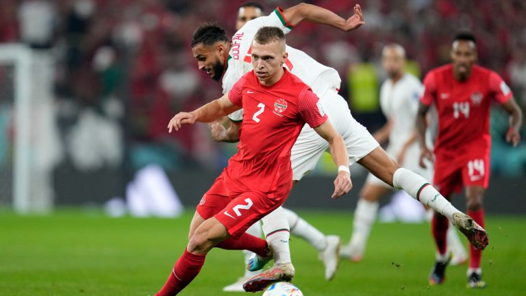 Canada's Alistair Johnston and Morocco's Sofiane Boufal challenge for the ball during the World Cup group F soccer match between Canada and Morocco at the Al Thumama Stadium in Doha , Qatar, Thursday, Dec. 1, 2022. (Natacha Pisarenko/AP)