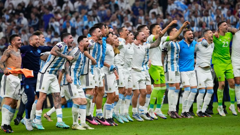 Argentina's players celebrate after the World Cup semifinal soccer match between Argentina and Croatia at the Lusail Stadium. (Manu Fernandez/AP)