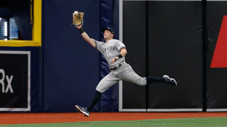 New York Yankees left fielder Andrew Benintendi catches a fly ball hit by Tampa Bay Rays' Ji-Man Choi during the first inning of a baseball game Friday, Sept. 2, 2022, in St. Petersburg, Fla. (Scott Audette/AP)