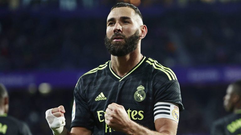 Real Madrid's Karim Benzema celebrates after scoring the opening goal with a penalty kick during a Spanish La Liga soccer match between Valladolid and Real Madrid at the Jose Zorrilla stadium in Valladolid, Spain, Saturday, Dec. 31, 2022. (Pablo Garcia/AP)