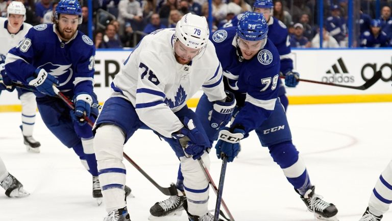 Toronto Maple Leafs defenseman TJ Brodie (78) and Tampa Bay Lightning center Ross Colton (79) battle for the puck during the second period in Game 3 of an NHL hockey first-round playoff series Friday, May 6, 2022, in Tampa, Fla. (Chris O'Meara/AP Photo)