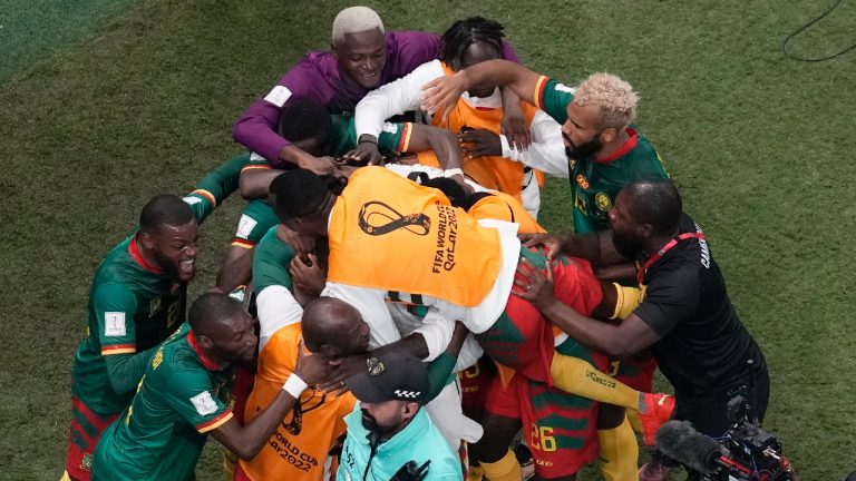 Cameroon players celebrate after scoring the opening goal during the World Cup group G soccer match between Cameroon and Brazil, at the Lusail Stadium in Lusail, Qatar, Friday, Dec. 2, 2022. (Thanassis Stavrakis/AP)