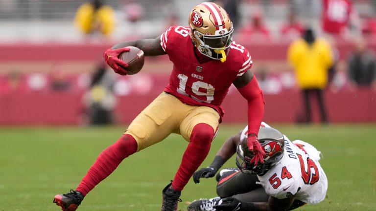 San Francisco 49ers wide receiver Deebo Samuel (19) runs in front of Tampa Bay Buccaneers linebacker Lavonte David (54) during the first half of an NFL football game in Santa Clara, Calif., Sunday, Dec. 11, 2022. (Tony Avelar/AP)