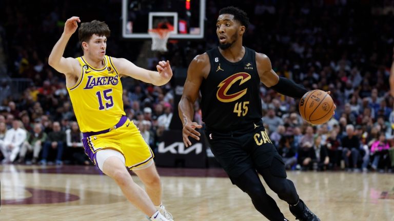 Cleveland Cavaliers guard Donovan Mitchell (45) drives against Los Angeles Lakers guard Austin Reaves (15) during the second half of an NBA basketball game Tuesday, Dec. 6, 2022, in Cleveland. (Ron Schwane/AP)