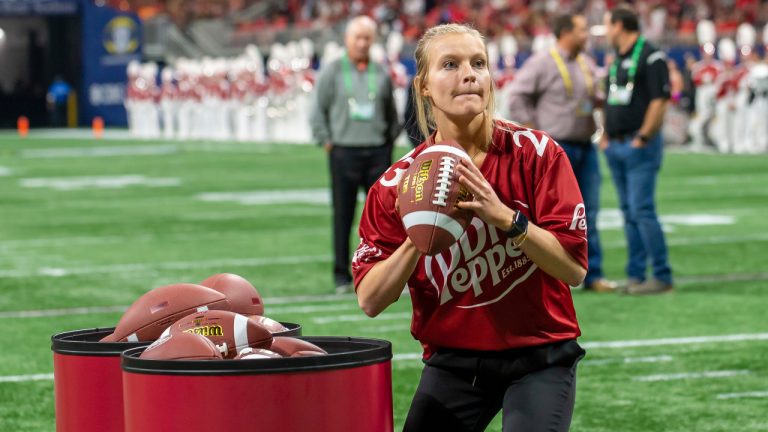 Rachel H. competing in the Dr Pepper Tuition Toss during halftime at the 2021 SEC Championship Game on December 4, 2021 at Mercedes-Benz Stadium in Atlanta, GA. (Bita Honarvar/AP)