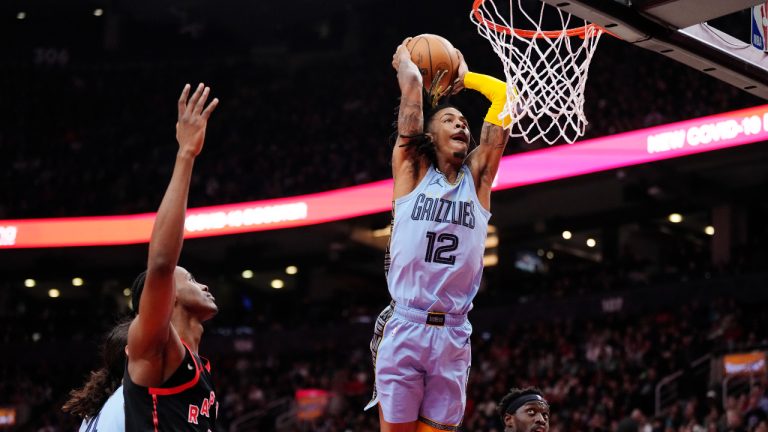 Memphis Grizzlies guard Ja Morant (12) dunks against the Toronto Raptors during first half NBA basketball action in Toronto on Thursday, December 29, 2022. (Frank Gunn/CP)