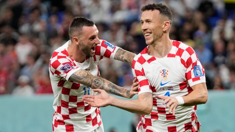 Croatia's Ivan Perisic, right, celebrates with teammate Croatia's Marcelo Brozovic after scoring his side's opening goal during the World Cup round of 16 soccer match between Japan and Croatia at the Al Janoub Stadium in Al Wakrah, Qatar, Monday, Dec. 5, 2022. (Thanassis Stavrakis/AP)