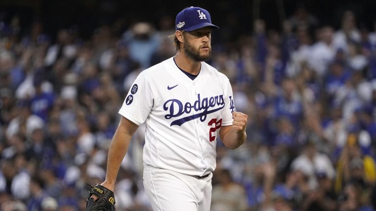 Los Angeles Dodgers starting pitcher Clayton Kershaw pumps his fist as he walks back to the dugout at the end of the top of the second inning in Game 2 of the baseball team's NL Division Series against the San Diego Padres, Wednesday, Oct. 12, 2022, in Los Angeles. (Mark J. Terrill/AP)