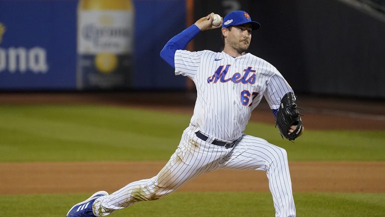 Former New York Mets relief pitcher Seth Lugo (67) delivers against the San Diego Padres during the seventh inning of Game 3 of a National League wild-card baseball playoff series, Sunday, Oct. 9, 2022, in New York. (John Minchillo/AP)