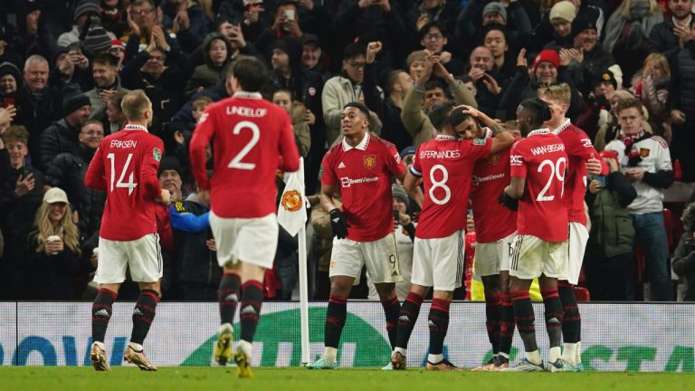 Manchester United's Marcus Rashford, third right, is mobbed by his teammates after scoring his sides second goal during the English League Cup 4th round soccer match between Manchester United and Burnley, at Old Trafford in Manchester, England Wednesday, Dec. 21, 2022. (Dave Thompson/AP)