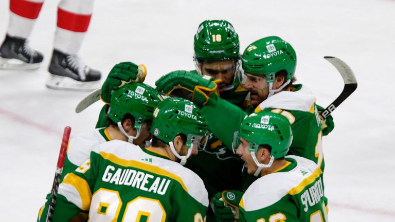 Minnesota Wild center Frederick Gaudreau (89) is congratulated by teammates Jared Spurgeon (46), Marcus Foligno (17), Jordan Greenway (18) and Sam Steel (13) after scoring a goal in the first period of an NHL hockey game against the Detroit Red Wings Wednesday, Dec. 14, 2022, in St. Paul, Minn. (Andy Clayton-King/AP)