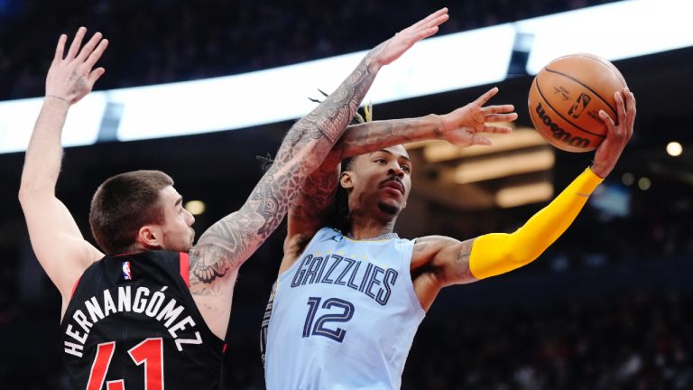 Memphis Grizzlies guard Ja Morant (12) drives to the basket past Toronto Raptors forward Juancho Hernangomez (41) during first half NBA basketball action in Toronto on Thursday, December 29, 2022. (Frank Gunn/CP)