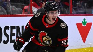 Ottawa Senators centre Shane Pinto (57) celebrates his goal on Montreal Canadiens goaltender Sam Montembeault (35), not shown, during second period NHL hockey action in Ottawa, on Wednesday, Dec. 14, 2022. (Justin Tang/CP)
