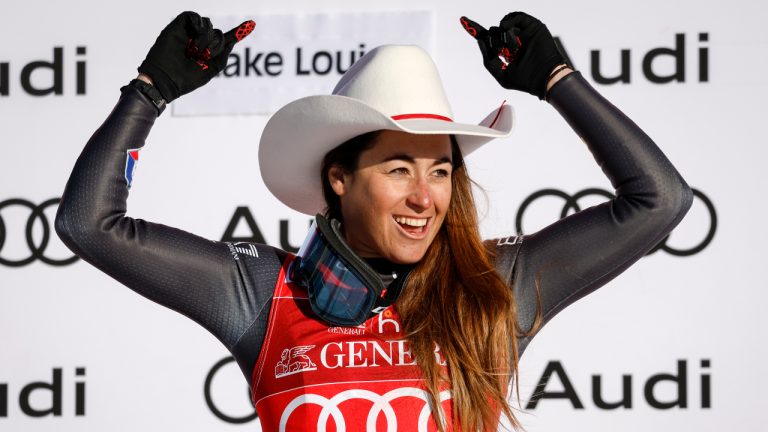 Italy's Sofia Goggia celebrates on the podium following the women's World Cup downhill ski race at Lake Louise, Alta., Saturday, Dec. 3, 2022.(Jeff McIntosh/CP)