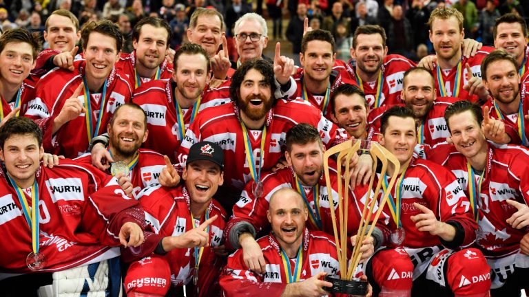 Team Canada celebrates after winning the final game between Team Canada and HC Ocelari Trinec at the 93th Spengler Cup ice hockey tournament in Davos, Switzerland, Tuesday, Dec. 31, 2019. (Gian Ehrenzeller/Keystone via AP)