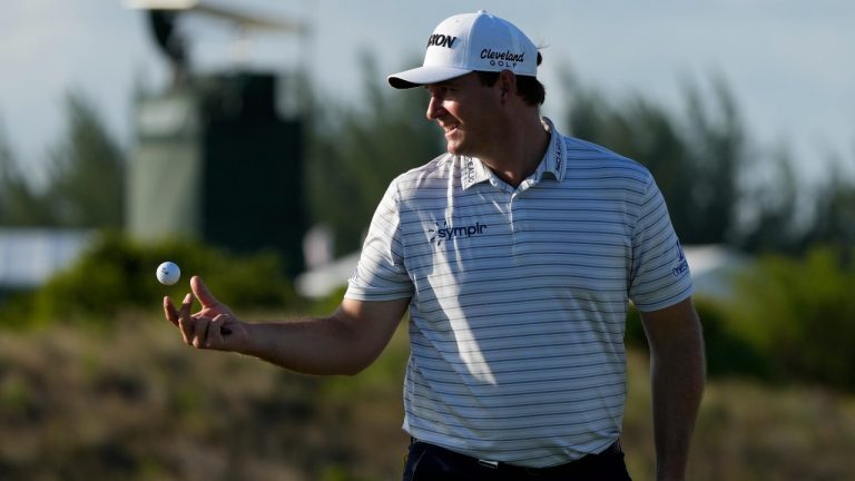Sepp Straka, of Austria, tosses a ball to his caddie during the first round of the Hero World Challenge PGA Tour at the Albany Golf Club, in New Providence, Bahamas, Thursday, Dec. 1, 2022. (Fernando Llano/AP Photo)