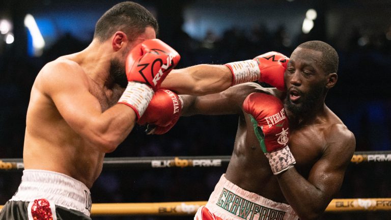 David Avanesyan, left, fights Terence Crawford during a World Boxing Organization welterweight world title boxing match on Saturday, Dec. 10, 2022, in Omaha, Neb. Crawford knocked out Avanesyan in the sixth round. (AP Photo/Rebecca S. Gratz)