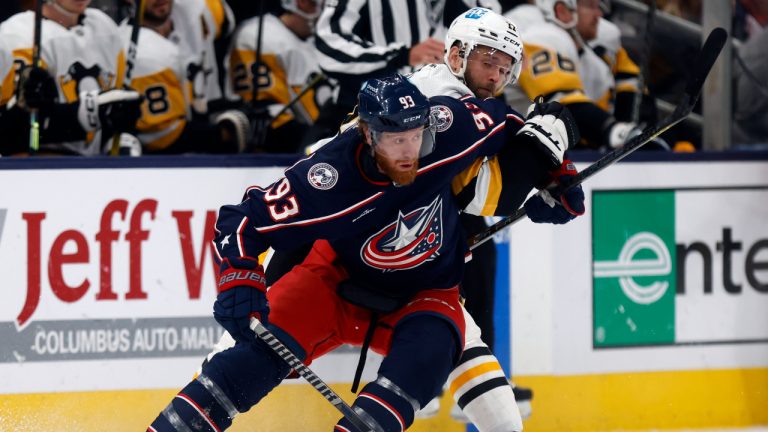 Columbus Blue Jackets forward Jakob Voracek, left, controls the puck in front of Pittsburgh Penguins forward Bryan Rust during the first period of an NHL hockey game in Columbus, Ohio, Saturday, Oct. 22, 2022. (Paul Vernon/AP)