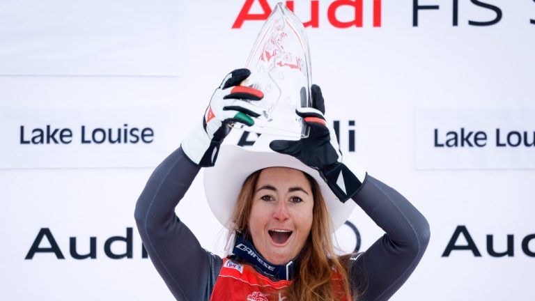 Italy's Sofia Goggia celebrates her victory on the podium following the women's downhill race at the FIS Alpine Skiing World Cup, in Lake Louise, Alta., Friday, Dec. 2, 2022. (Jeff McIntosh/The Canadian Press)