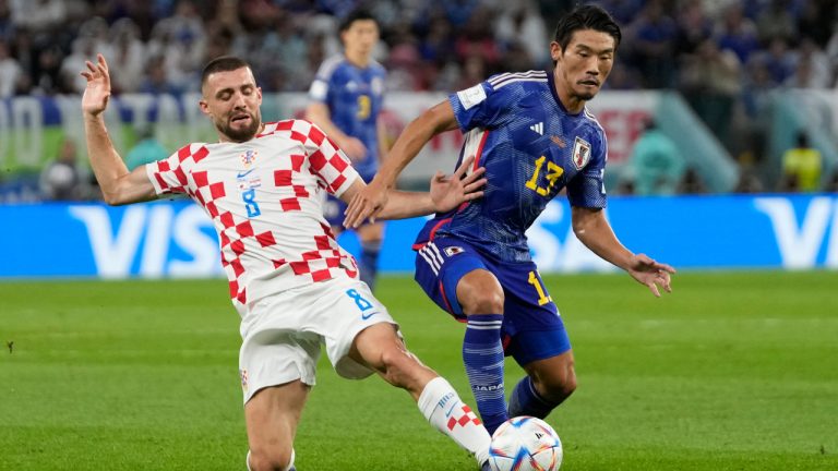 Japan's Hidemasa Morita, right, challenges for the ball with Croatia's Mateo Kovacic during the World Cup round of 16 soccer match between Japan and Croatia at the Al Janoub Stadium in Al Wakrah, Qatar, Monday, Dec. 5, 2022. (Thanassis Stavrakis/AP) 