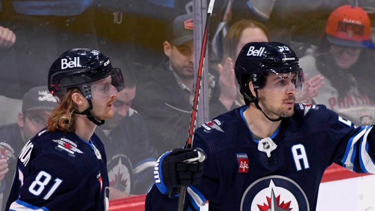 Winnipeg Jets’ Mark Scheifele (55) celebrates his goal against the Florida Panthers with Kyle Connor (81) during first period NHL action in Winnipeg on Tuesday, December 6, 2022. THE CANADIAN PRESS/Fred Greenslade