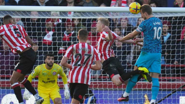 Tottenham's Harry Kane, right, scores his side's first goal during the English Premier League soccer match between Brentford and Tottenham Hotspur at the Gtech Community Stadium in London, Monday, Dec. 26, 2022. (Kirsty Wigglesworth/AP)