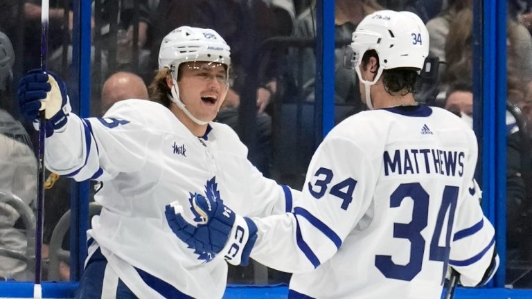 Toronto Maple Leafs right wing William Nylander (88) celebrates his goal against the Tampa Bay Lightning with center Auston Matthews (34) and defenseman Mark Giordano (55) during the second period of an NHL hockey game Saturday, Dec. 3, 2022, in Tampa, Fla. (Chris O'Meara/AP)