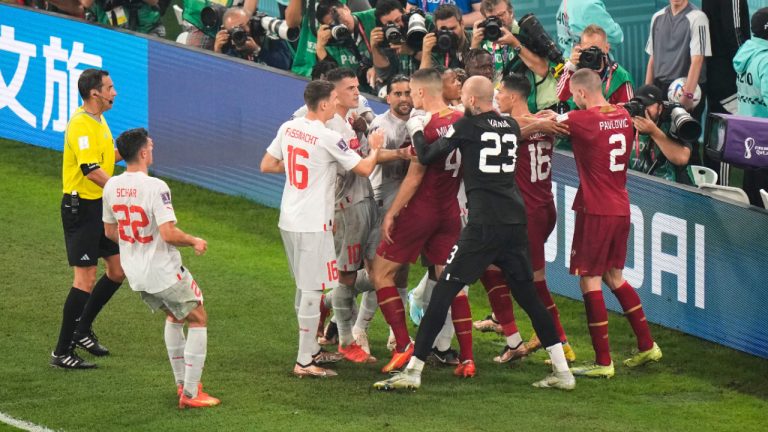 Switzerland's and Serbia's players, in red, argue during the World Cup group G soccer match between Serbia and Switzerland, at the Stadium 974 in Doha, Qatar, Friday, Dec. 2, 2022. (Luca Bruno/AP) 