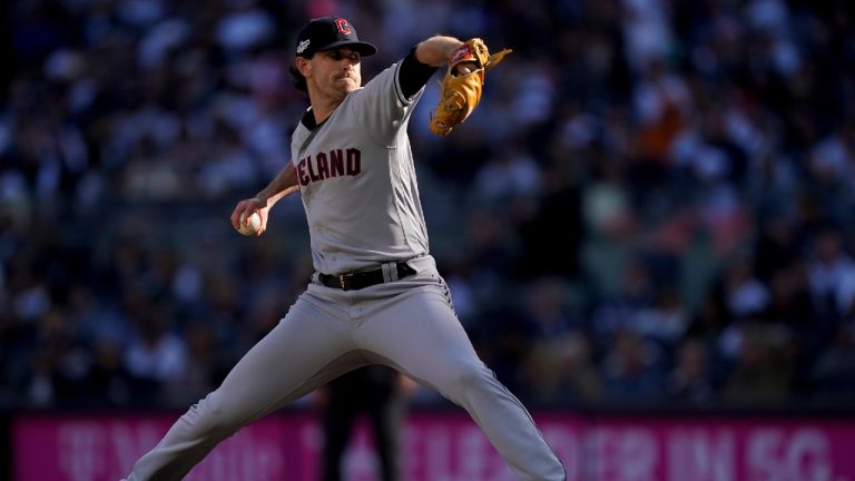 Cleveland Guardians starting pitcher Shane Bieber delivers against the New York Yankees during the seventh inning of Game 2 of an American League Division baseball series, Friday, Oct. 14, 2022, in New York. (John Minchillo/AP)