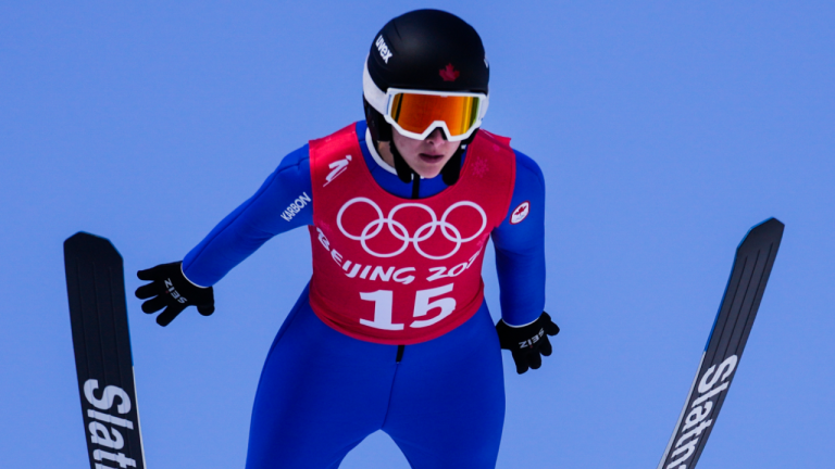Abigail Strate, of Canada, soars through the air during a women's normal hill ski jumping training session at the 2022 Winter Olympics, Friday, Feb. 4, 2022, in Zhangjiakou, China. (AP)