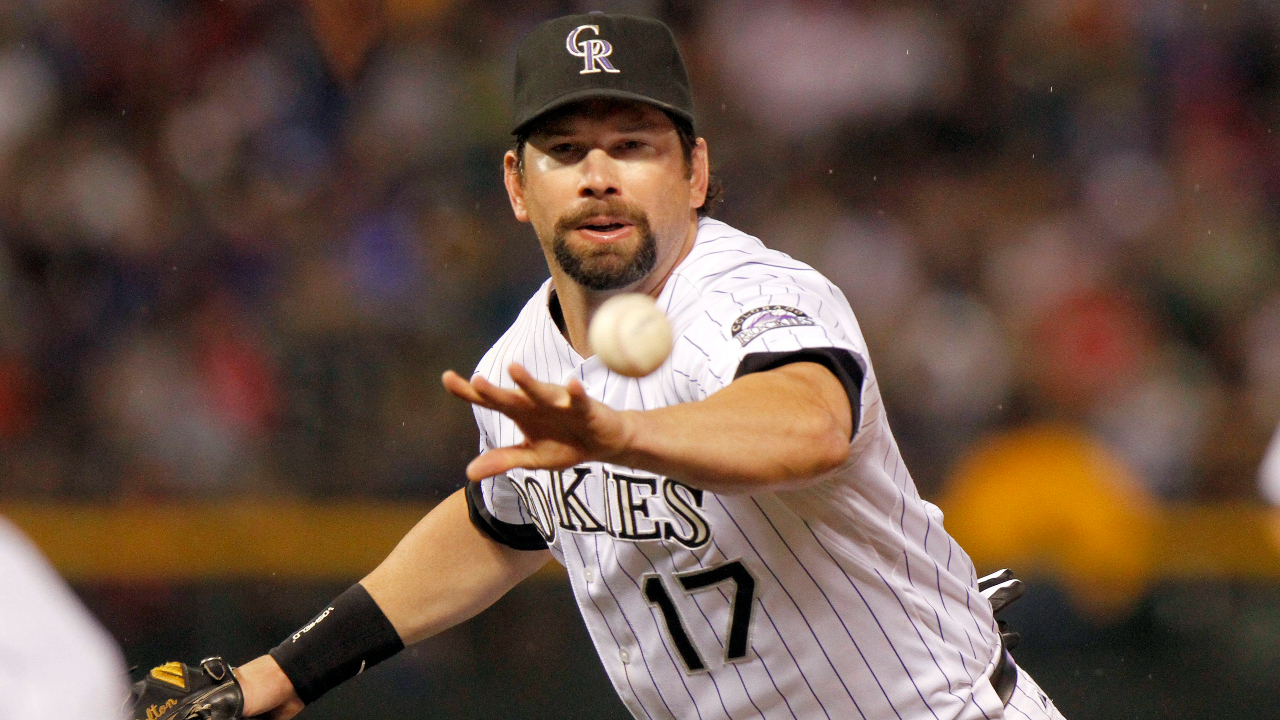 Colorado Rockies first baseman Todd Helton throws out Philadelphia Phillies' Placido Polanco during the sixth inning of a baseball game in Denver. (AP Photo/Barry Gutierrez)