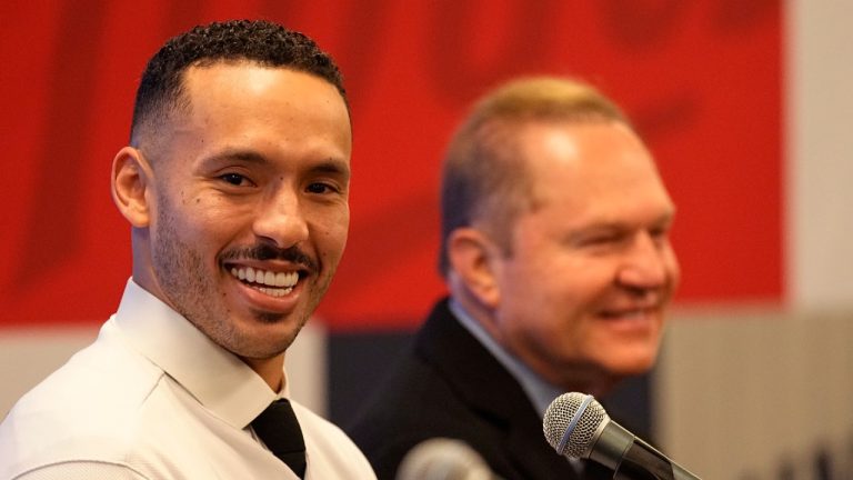 Minnesota Twins baseball player Carlos Correa, left, and Agent Scott Boras speak to the media during a press conference at Target Field Wednesday, Jan. 11, 2023, in Minneapolis. The team and Correa agreed to a six-year, $200 million contract. (Abbie Parr/AP)